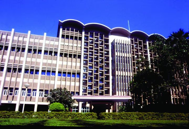 Indian Institute of Technology Bombay campus with modern buildings and students. 